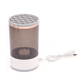 Everyday Needs and Wants makeup brush cleaner in a clear bottle with a brush cleaning solution and applicator for makeup brushes.
