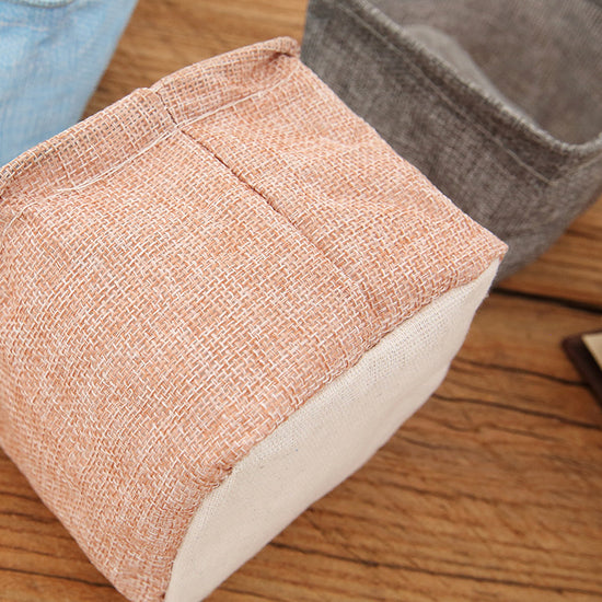 Mini cotton and linen storage basket for desk organization by Everyday Needs and Wants, with woven texture and compact design.