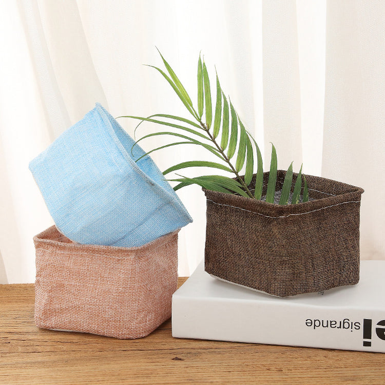 Mini cotton and linen storage basket for desk organization by Everyday Needs and Wants, featuring a woven design and compact size.