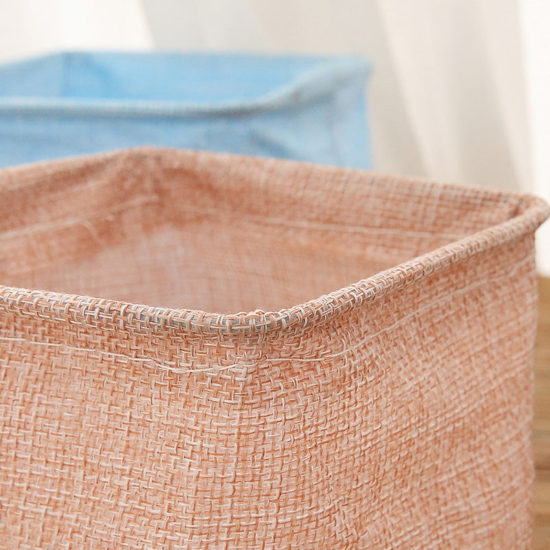 Mini cotton and linen storage basket for desk organization, by Everyday Needs and Wants, with a cozy, natural fabric look.