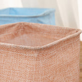 Mini cotton and linen storage basket for desk organization, by Everyday Needs and Wants, with a cozy, natural fabric look.