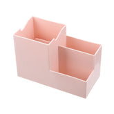 Everyday Needs and Wants multifunctional pen holder and remote storage box on desk, organized with pens and remote controls.
