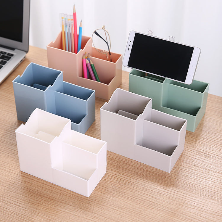Multifunctional pen holder and remote storage box by Everyday Needs and Wants, with compartments for pens, remote controls, and small accessories.