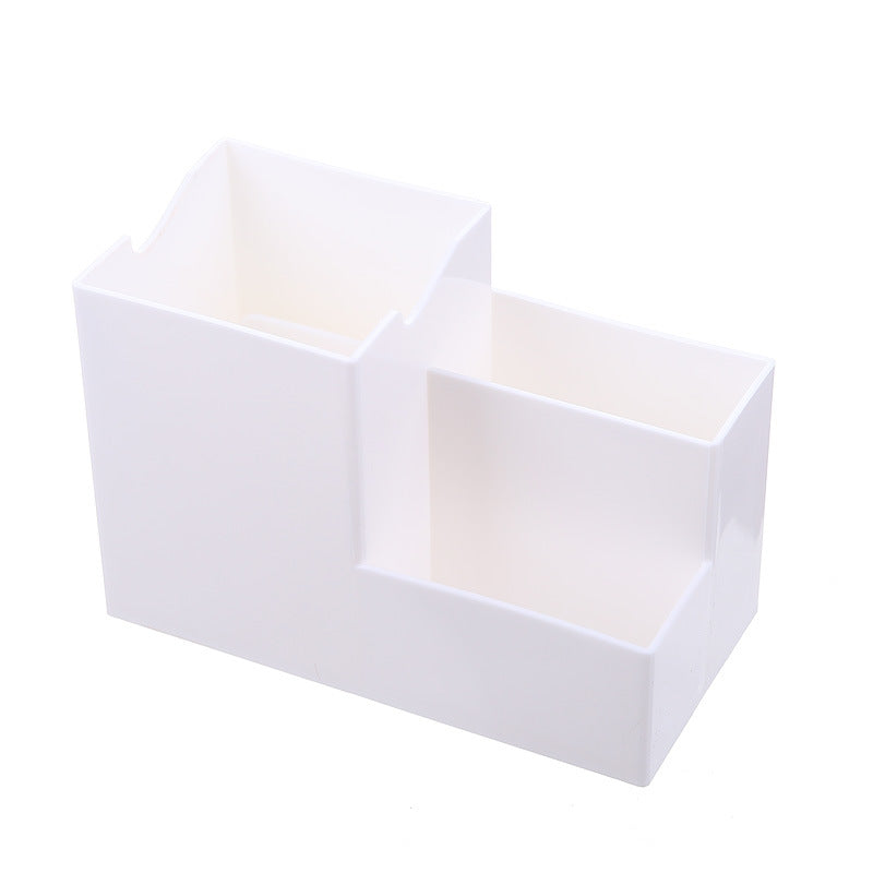 Multifunctional pen holder and remote storage box from Everyday Needs and Wants, with compartments for pens, remotes, and small accessories.