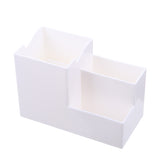 Multifunctional pen holder and remote storage box from Everyday Needs and Wants, with compartments for pens, remotes, and small accessories.