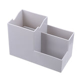 Multifunctional pen holder and remote storage box by Everyday Needs and Wants, with compartments for pens, remotes, and small items.