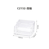 Acrylic business card holder with a creative design, ideal for organizing and displaying business cards on a desk.