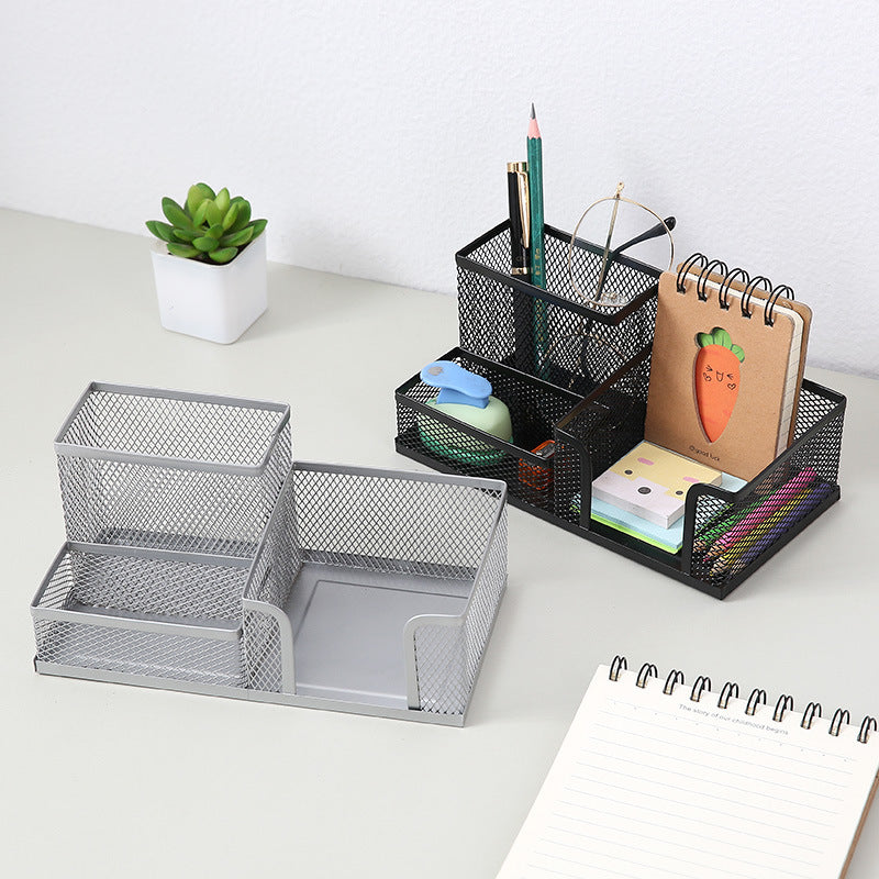 Creative metal four-grid pen holder for office use, with multiple compartments for organizing pens, pencils, and stationery.