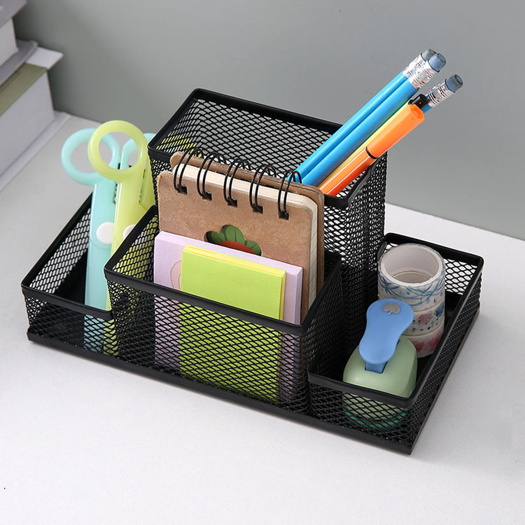 Creative metal four-grid pen holder for office use, with organized compartments for pens, pencils, and stationery.