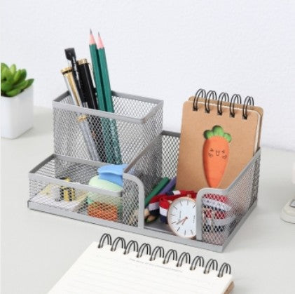 Creative metal four-grid pen holder for office use, with multiple compartments for organizing pens and office supplies.