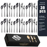 Black stainless steel Western cutlery spoon set with eight spoons displayed on a white background.