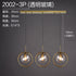 Nordic modern minimalist glass pendant light hanging from ceiling, sleek transparent design for contemporary interior decor