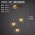 Nordic modern minimalist glass pendant light hanging from ceiling, sleek design with clear glass shade and metal fixture.